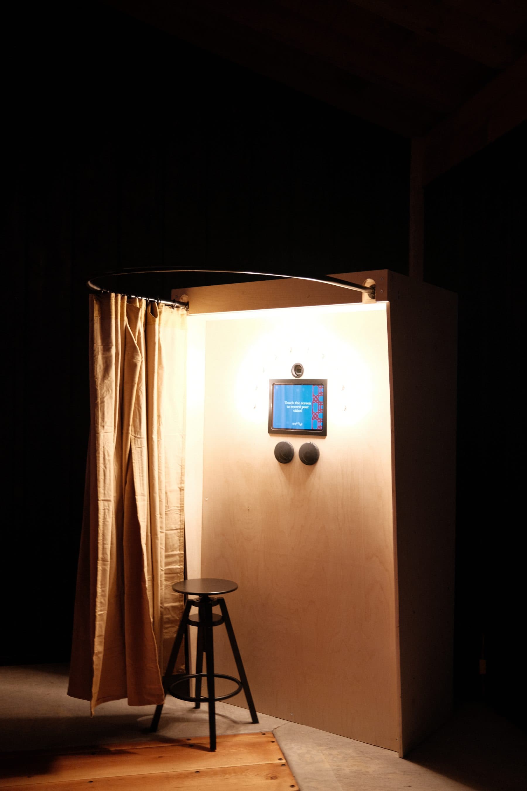 The arched top of the booth lit from within