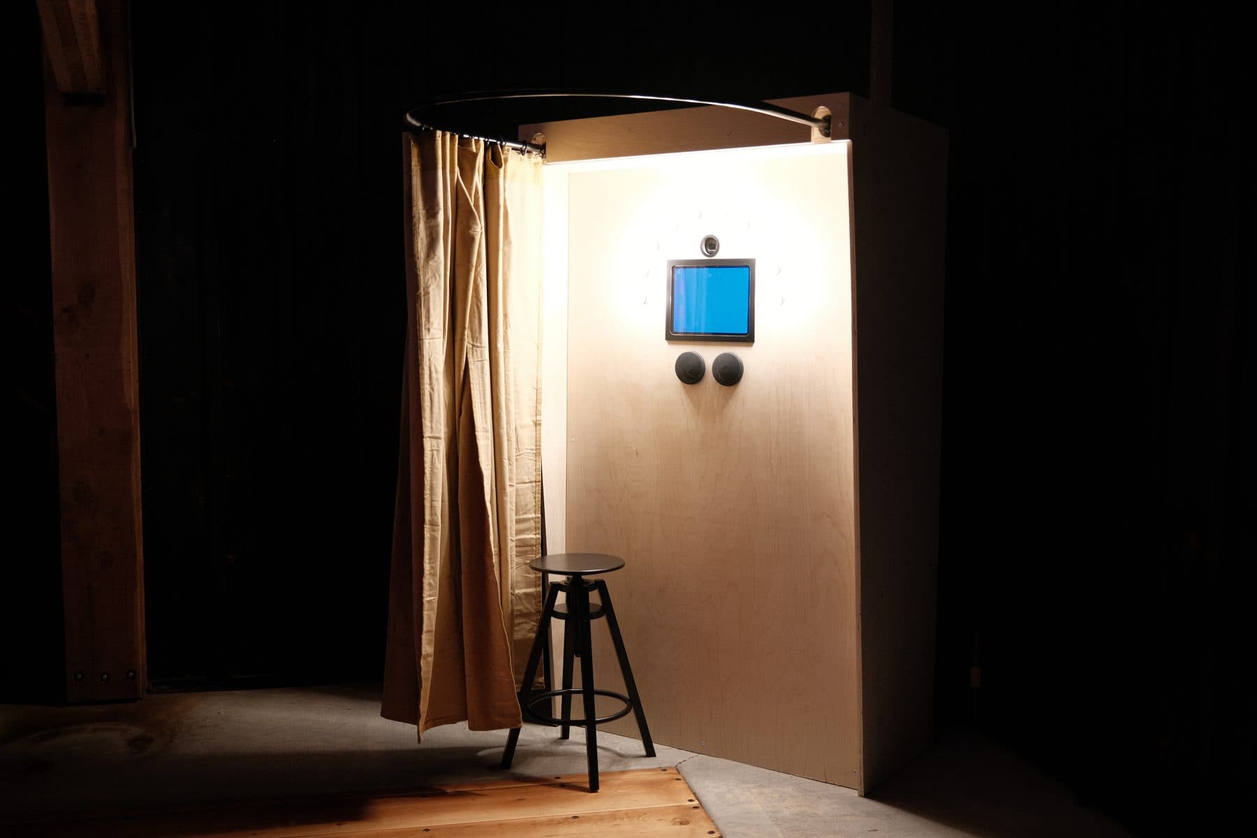 The Bright Booth glowing in a dark reception hall