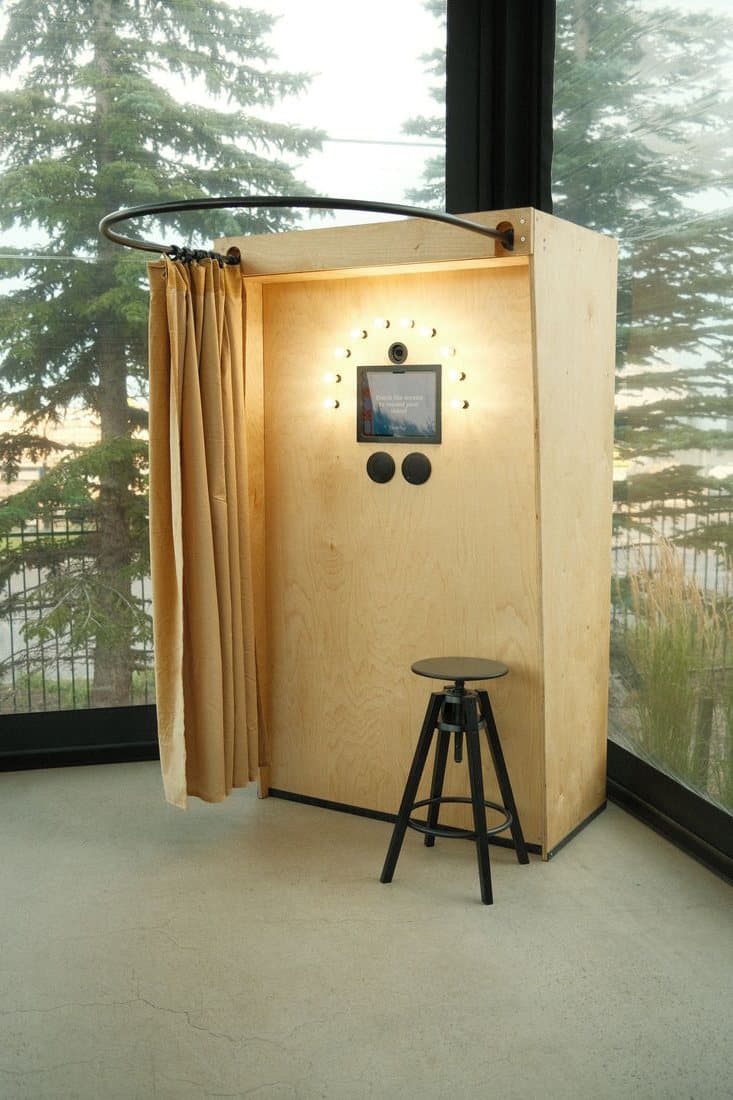 The Bright Booth, curtain and stool, set up beside a window