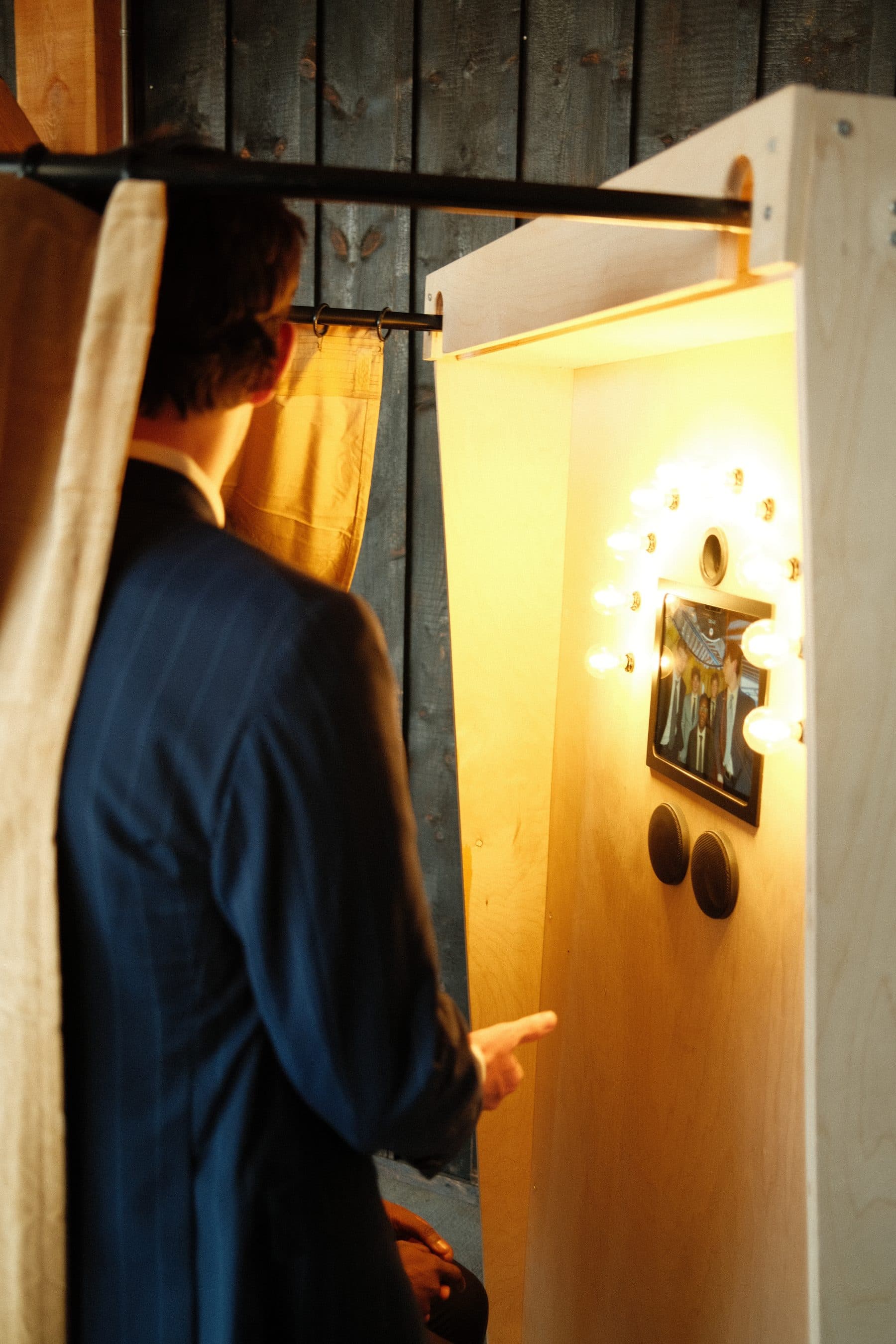 A guest recording a message inside the Bright Booth