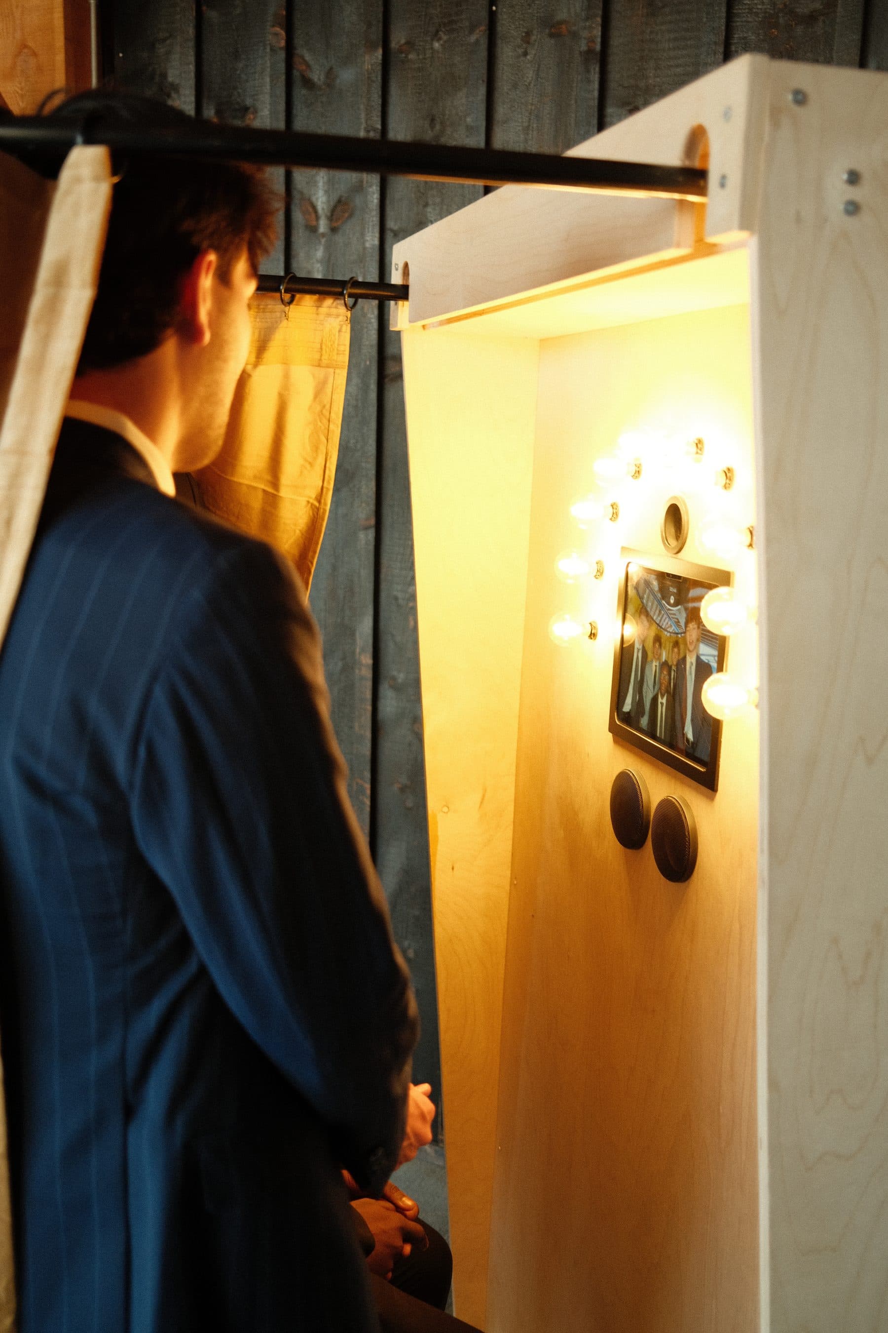 A guest in a blue suit starting his recording